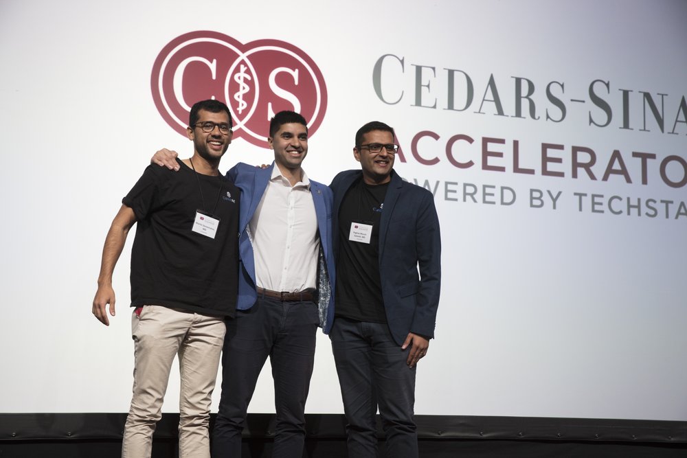 Members of the CancerAid team — Nik, Raghav, and Martin — at Class 3 Demo Day in December 2017.